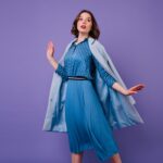 emotional-brunette-woman-blue-coat-posing-purple-wall-indoor-photo-beautiful-short-haired-female-model-trendy-midi-dress