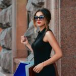 fashionable-slim-brunette-woman-costumer-with-shopping-bags-by-shop