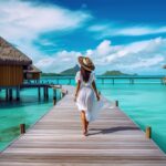 woman-walks-pier-bora-bora-french-polynesia